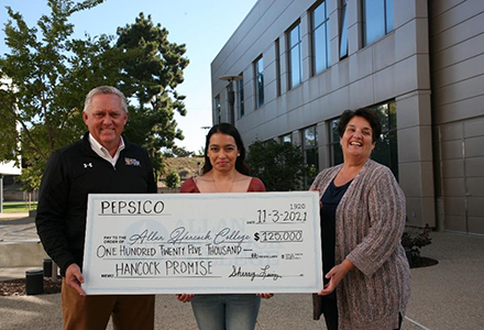 AHC Superintendent/President Kevin G. Walthers, Ph.D, ASBG President Marcela Viveros and PepsiCo Account Manager Sherry Luiz celebrate a generous donation to the college’s Promise program.  